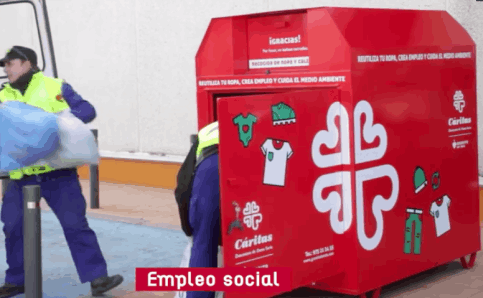 Caritas workers emptying a collection container