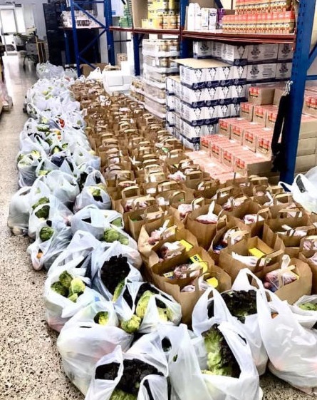 Hundreds of prepared food donation bags ready to be given out at Mallorca Sense Fam