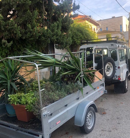 The YGB van with a trailer full of plants
