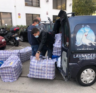A laundry van delivers washed bedlinen to the shelter Llar Kurt