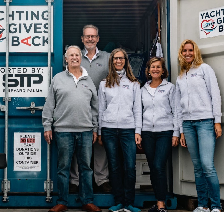 Yachting Gives Back team in front of the container