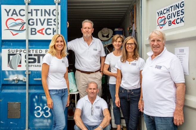 YGB team in front of the container
